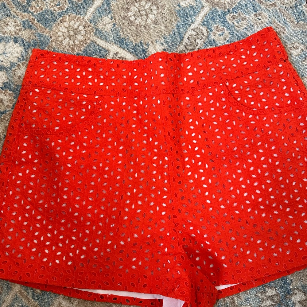 Woman’s orange eyelet shorts